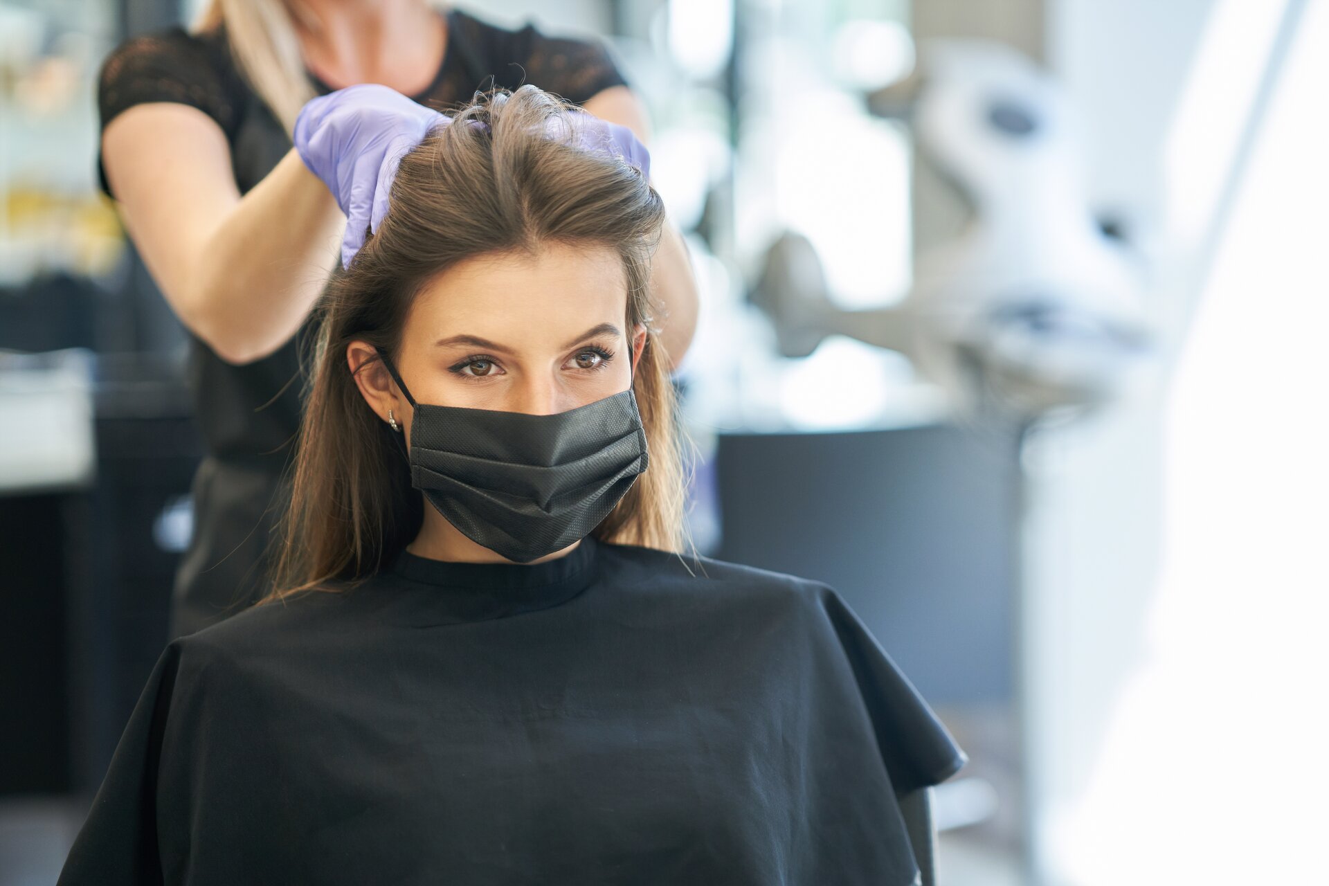 stock-photo-adult-woman-at-hairdresser-wearing-protective-mask-due-to-coronavirus-pandemic-1756653821